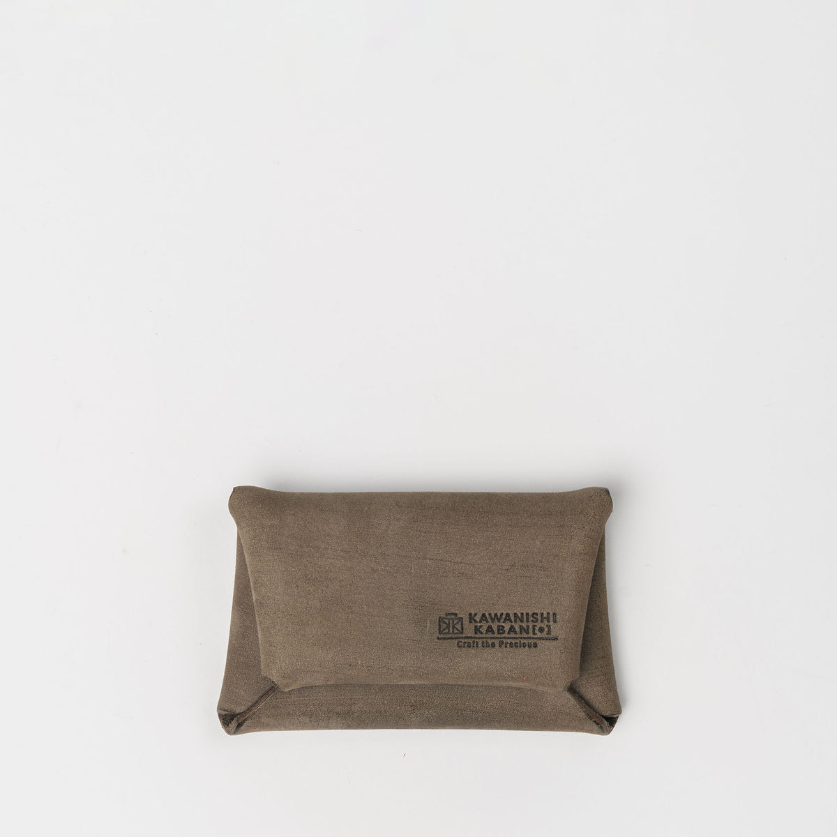 A pillow-shaped coin and card holder made from Setouchi leather by